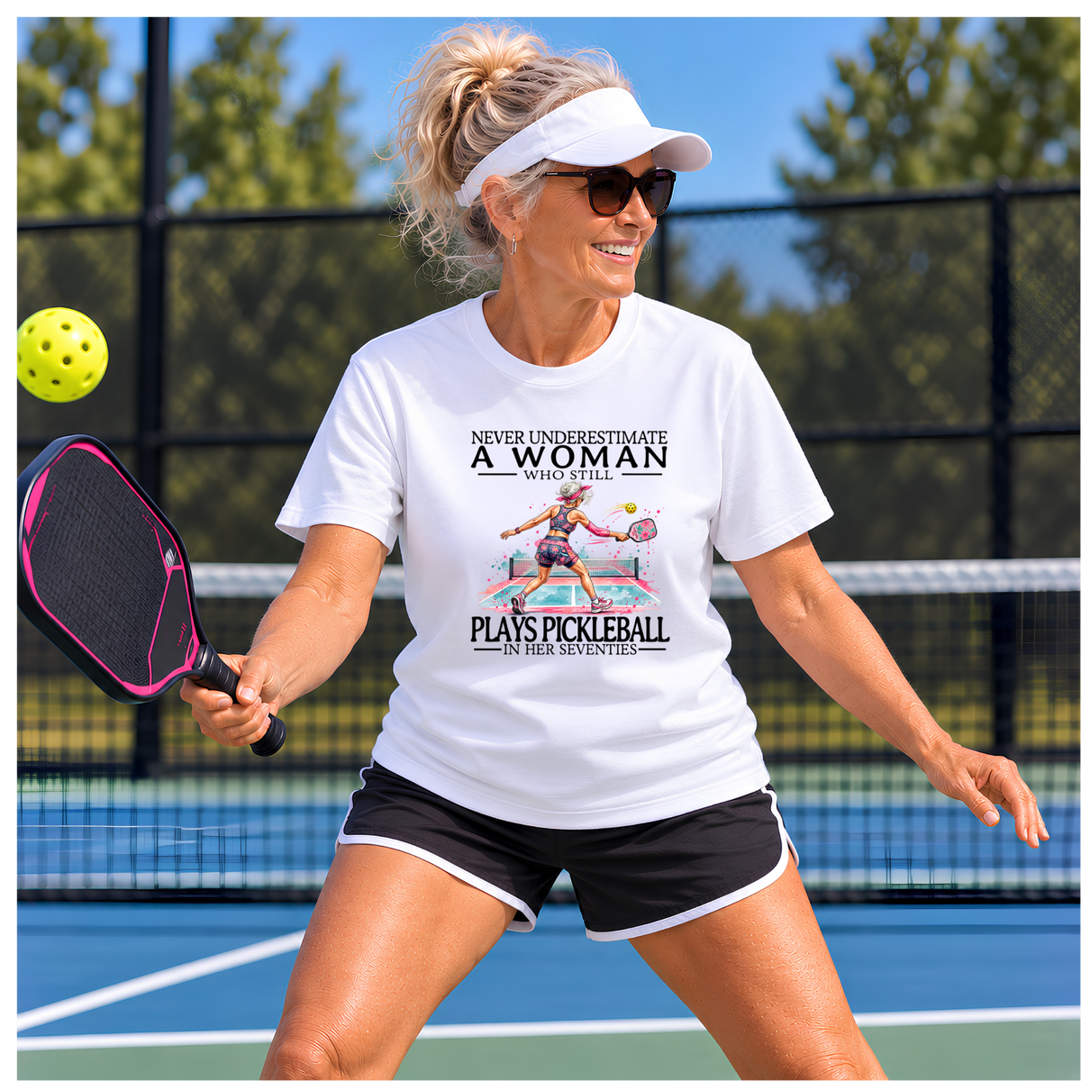 Never Underestimate a Woman Who Still Plays Pickleball in Her Seventies – Women’s Gildan Heavy Cotton Tee